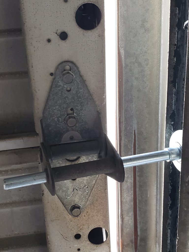 Garage door hinge and roller