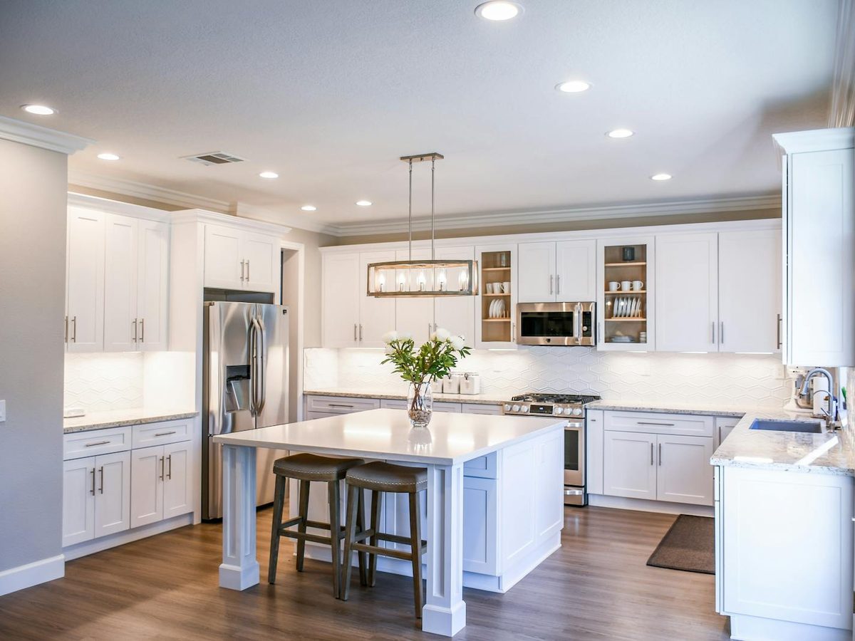 Coastal Hampton Roads home with a prominent two-car garage door, the kind of property exposed to salt air and Atlantic wind