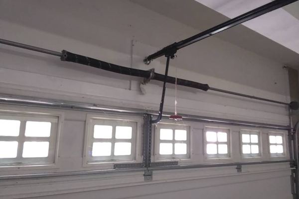 Garage door spring replacement cost example: a new matched pair of 207-wire torsion springs installed on a Suffolk VA door for $509