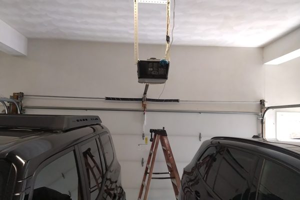 Garage door spring repair in Virginia Beach finished, the door closed and balanced with both cars back inside the garage