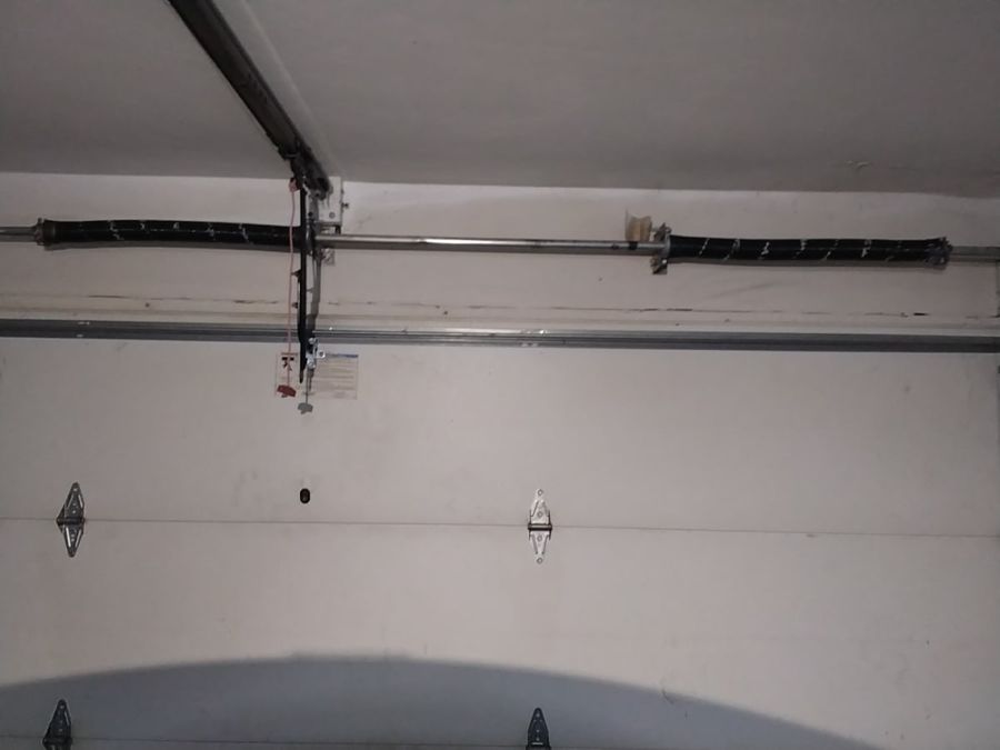 After a garage door spring broke on one side in Virginia Beach: two new torsion springs installed as a pair on the same shaft