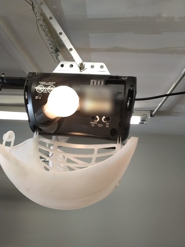 20 year old garage door opener with a failed motor in a Virginia Beach garage, the repair cost was not worth it so the opener was replaced