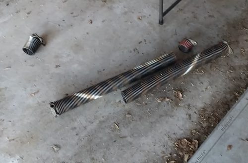 Old torsion springs removed from a Virginia Beach garage door that would not lift with the opener, the problem was the springs not the opener